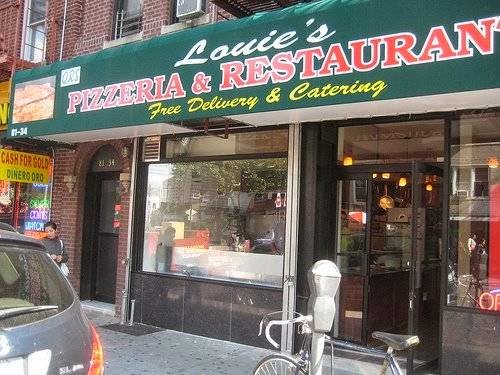 Storefront pizzeria with a classic New York look.