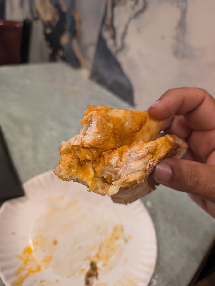 Pizza slices on plates beside Italian comfort food.