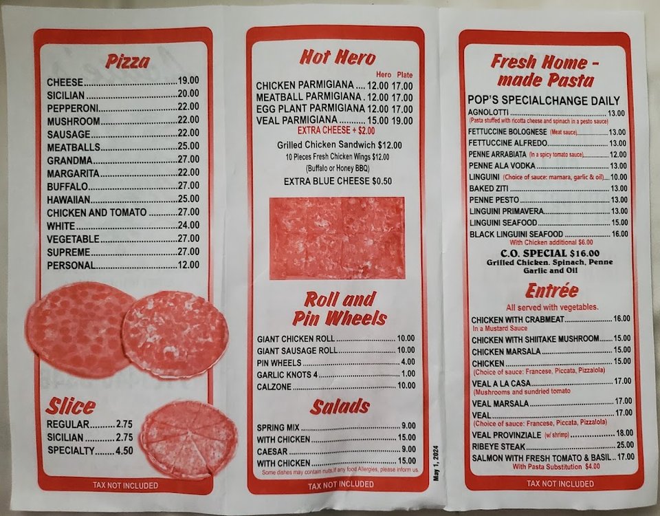 Pizza and pasta dishes on a restaurant table.